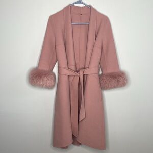 Pink wrap coat with for cuffs belted three quarter length sleeve with pockets